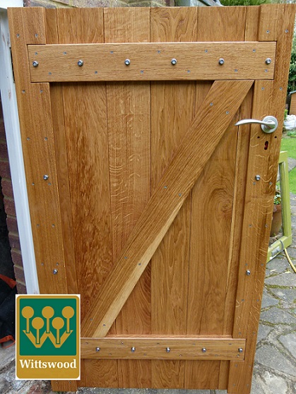 This image features an Exterior Solid Oak Ledge and Brace Door which is Screwed and Bolted.